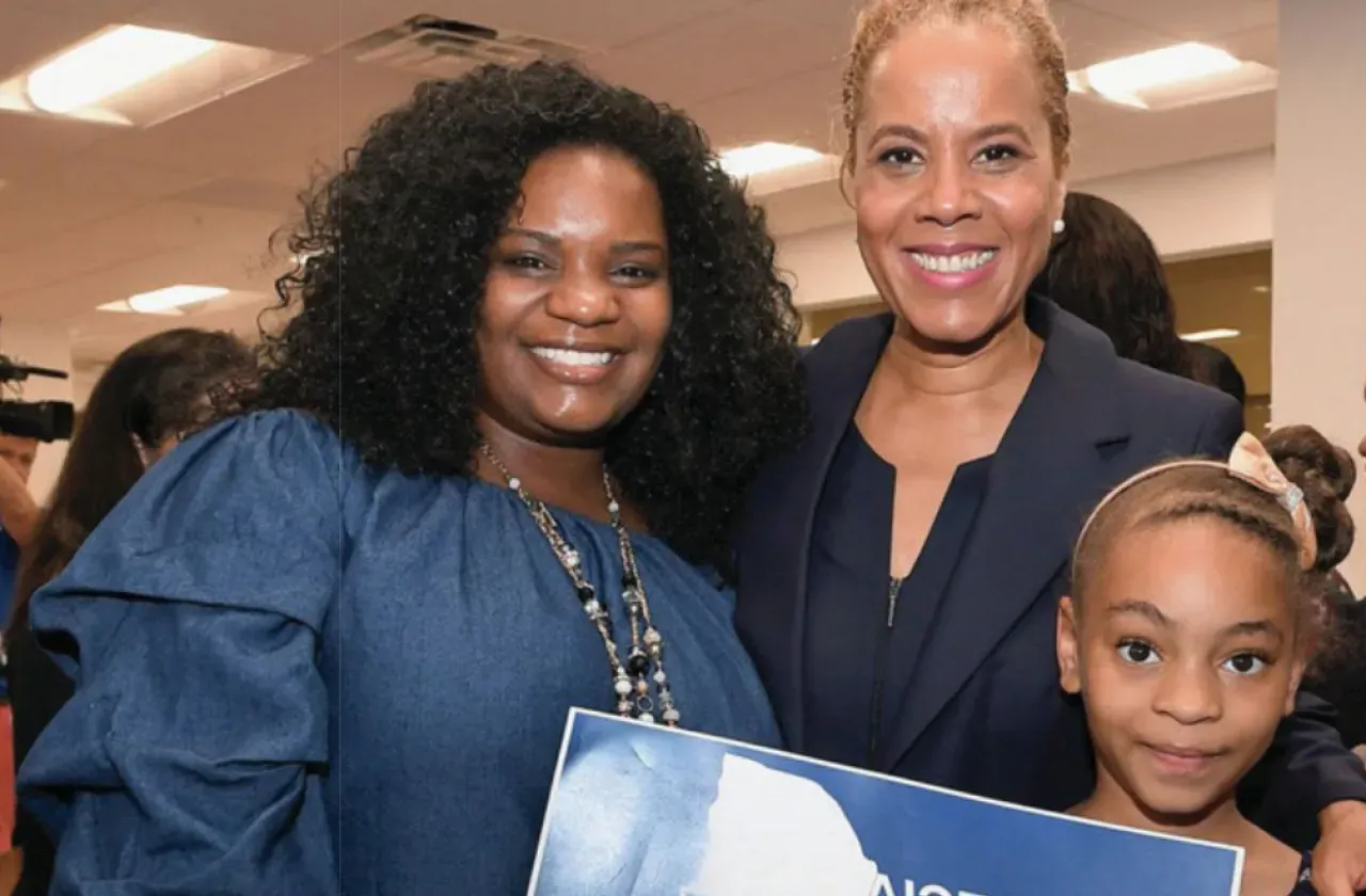 Leecia Eve with two supporters